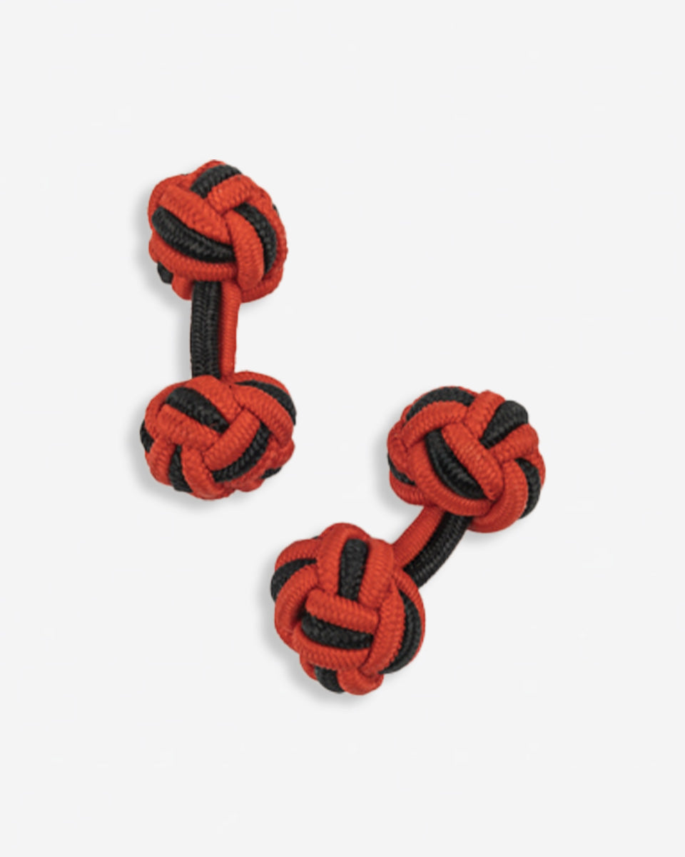 Cufflinks in the shape of a woven knot, made of metal and gold plated