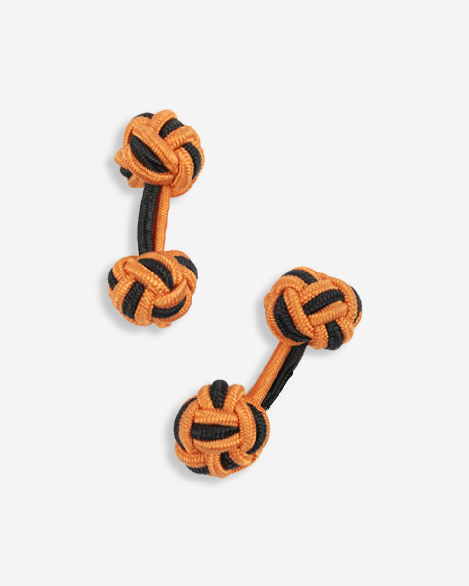 Cufflinks in the shape of a woven knot, made of metal and gold plated