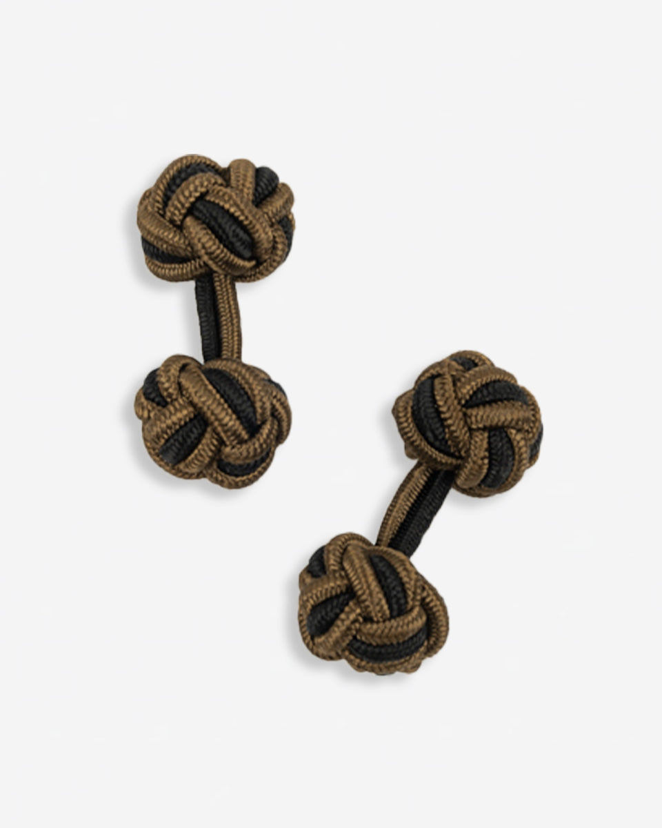 Cufflinks in the shape of a woven knot, made of metal and gold plated