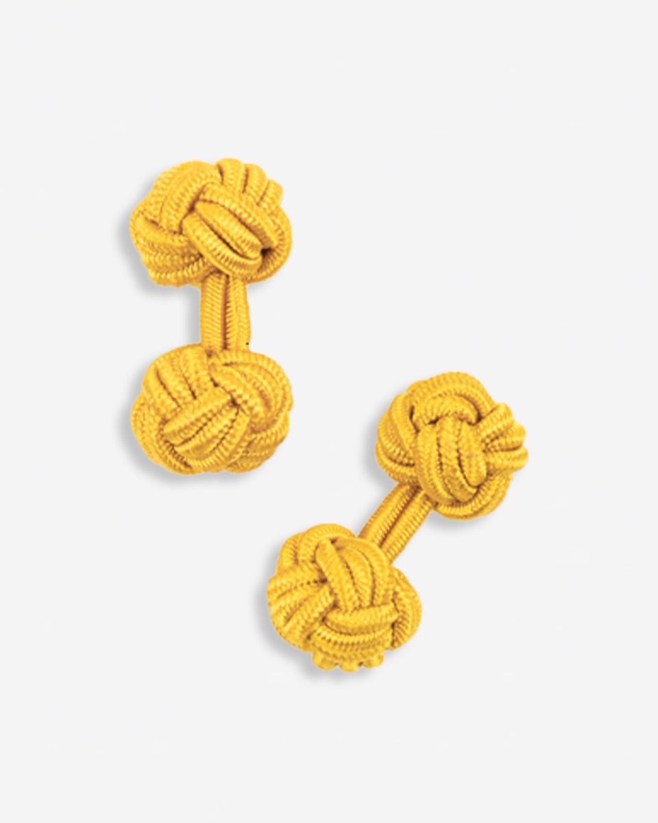 Cufflinks in the shape of a woven knot, made of metal and gold plated