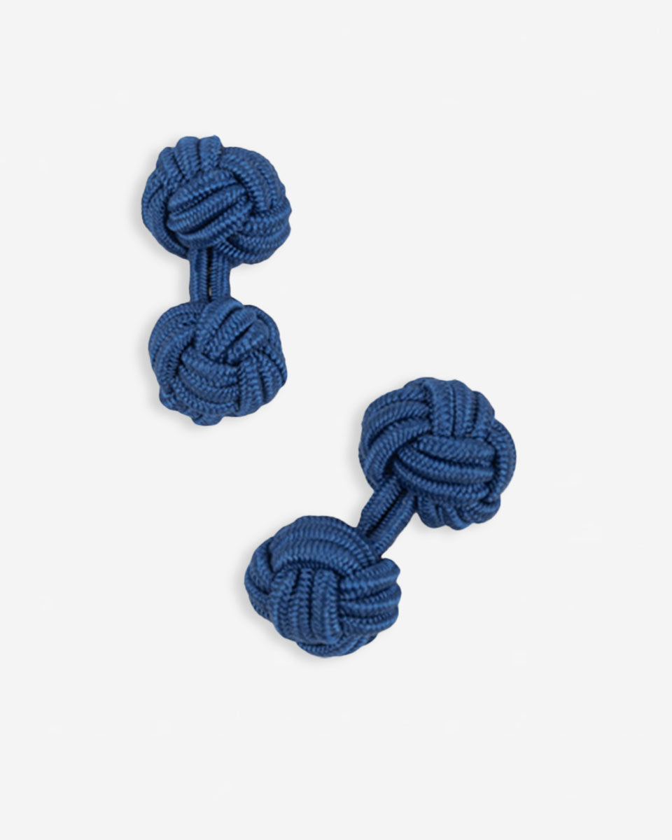 Cufflinks in the shape of a woven knot, made of metal and gold plated