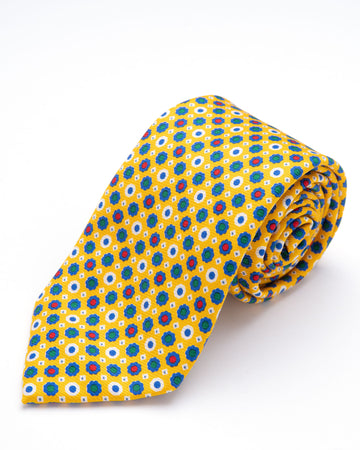 CORBATA AMARILLO CON DISEÑO DE FLORES AZULES CON PUNTOS VERDE Y ROJO