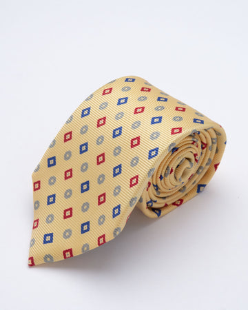 CORBATA AMARILLO PASTEL CON ROMBOS ROJOS Y AZULES