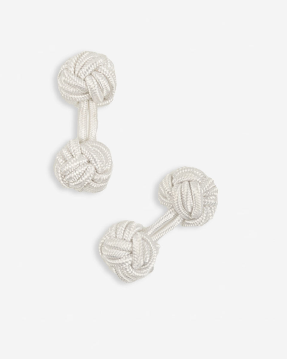 Cufflinks in the shape of a woven knot, made of metal and gold plated