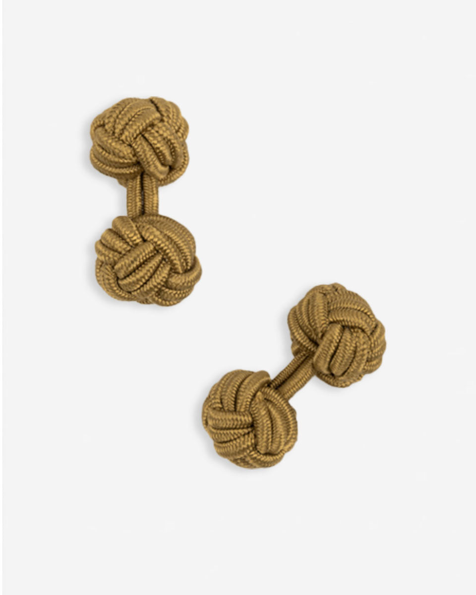 Cufflinks in the shape of a woven knot, made of metal and gold plated