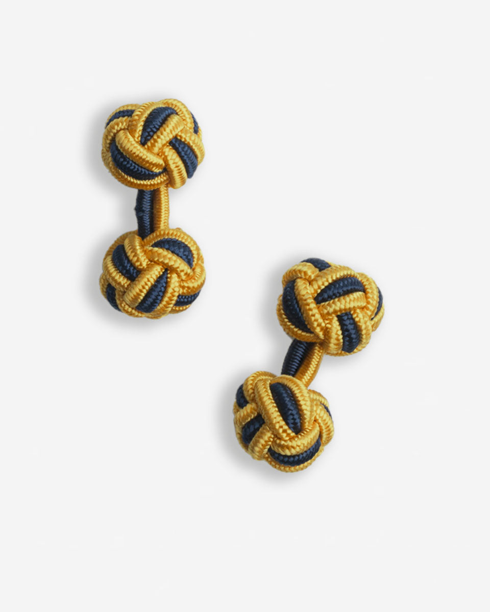 Cufflinks in the shape of a woven knot, made of metal and gold plated