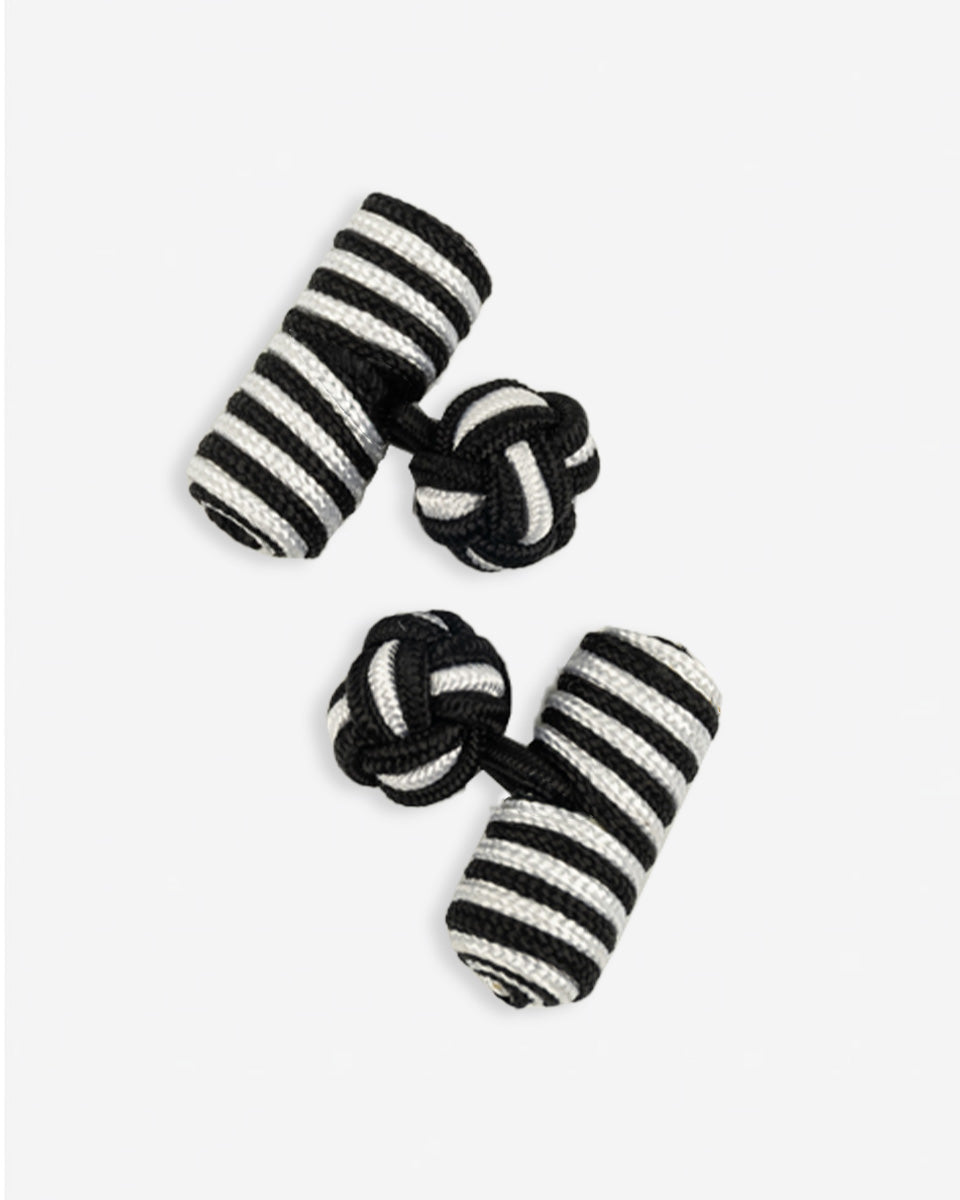 Cufflinks in the shape of a woven knot, made of metal and gold plated